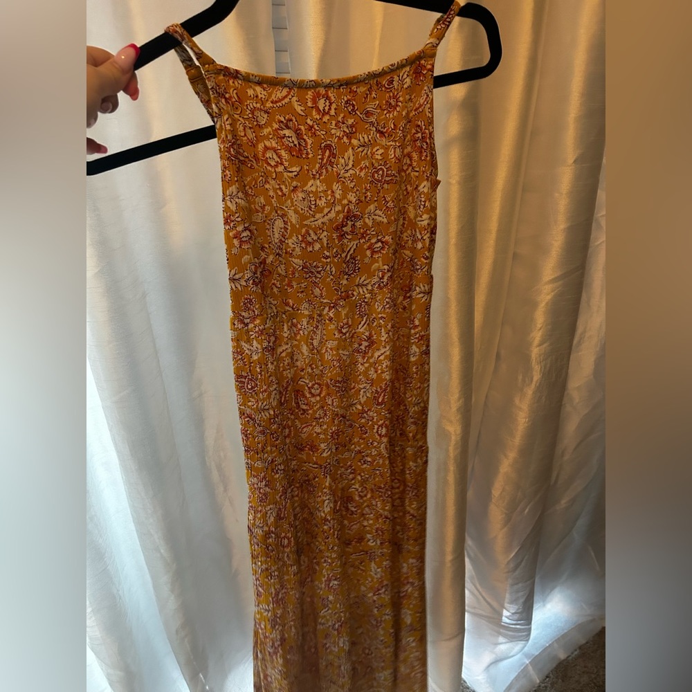 A yellow flowered girls dress